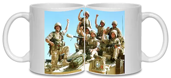 British infantrymen celebrate on a Warrior Armoured Personnel Carrier during the Gulf