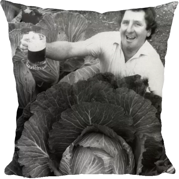 Phil Vowles with a cabbage which he watered with beer 1986
