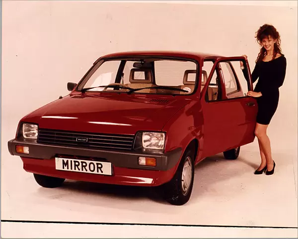 RED METRO MODEL STANDING NEXT TO CAR COMPETITION PRIZE MINI METRO