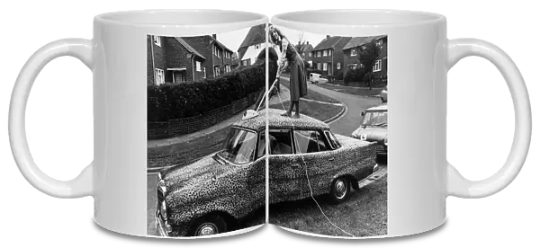 Mercedes car covered in leopard skin being hoovered 1989 Housework cleaning car