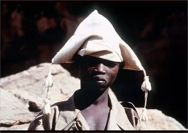 Mali Dagon Tribe a adolescent from the tribe wearing a traditional hat