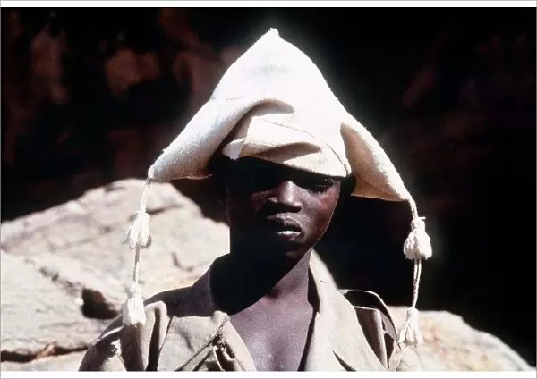 Mali Dagon Tribe a adolescent from the tribe wearing a traditional hat