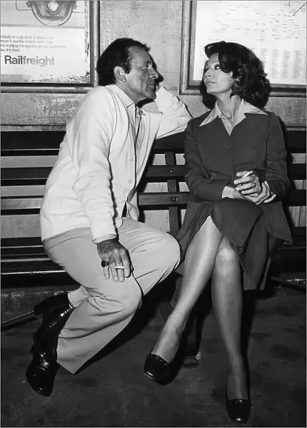 Richard Burton with Sophia Loren on a bench at a train station filming the play brief