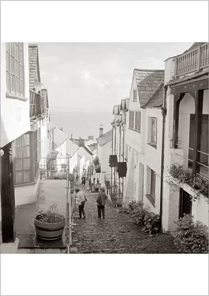 Tourists making their way down the steep hill in the village of Clovelly in North Devon