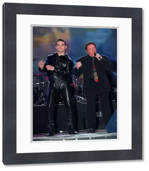 Tom Jones Singer February 1998, performing at Brit Awards with Robbie Williams