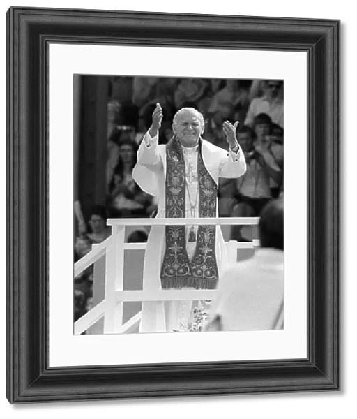 Pope John Paul II blesses the crowd during his visit to Cardiff