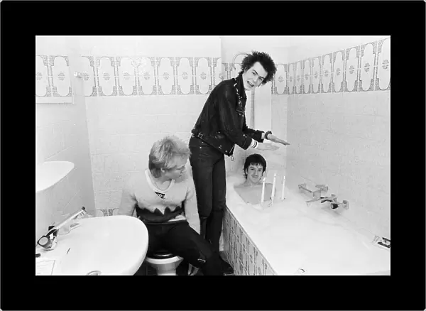 Punk band Sex Pistols relax during their tour of Holland in the hotel bathroom