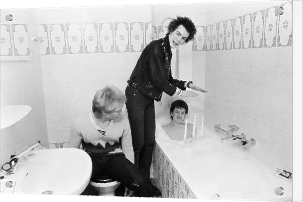 Punk band Sex Pistols relax during their tour of Holland in the hotel bathroom