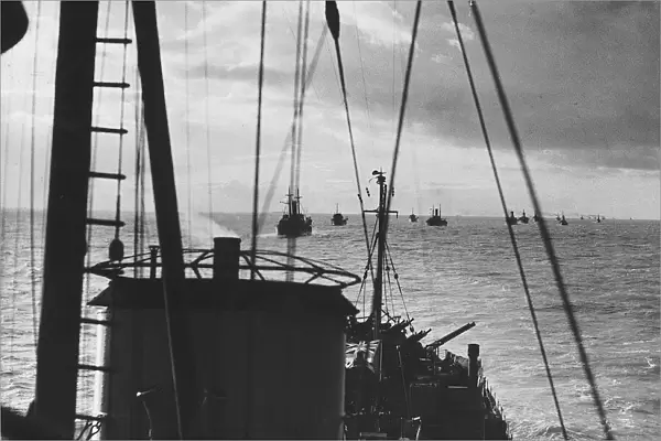 Convoy of ships with a destroyer escort crosses the Atlantic during WW2 1943