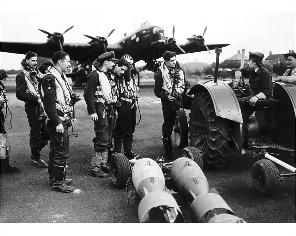 WW2 WaF Auxiliary Air Force driver discusses the arming of a bomber with its crew