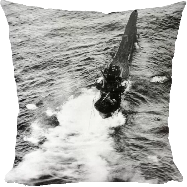 The crew of a sinking German U Boat scramble into the lifeboats after being hit by a