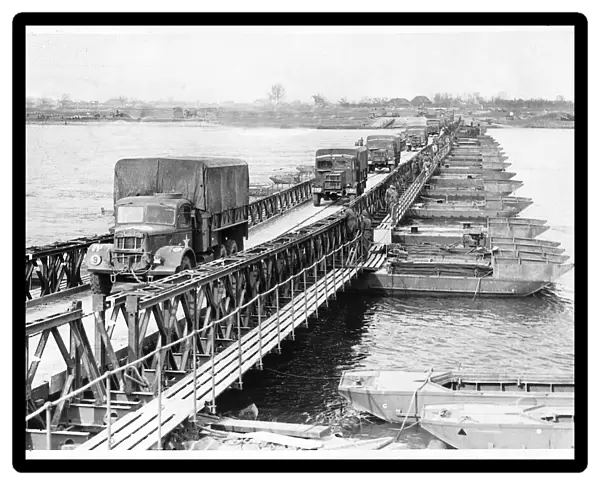 WW2 - March 1945 Allied army trucks crossing the Bailey pontoon bridge over the Rhine