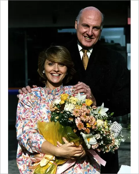 Anne Diamond TV presenter holding a bouquet of flowers
