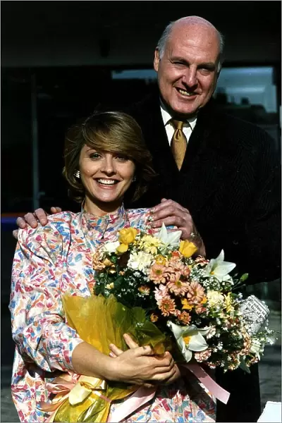 Anne Diamond TV presenter holding a bouquet of flowers