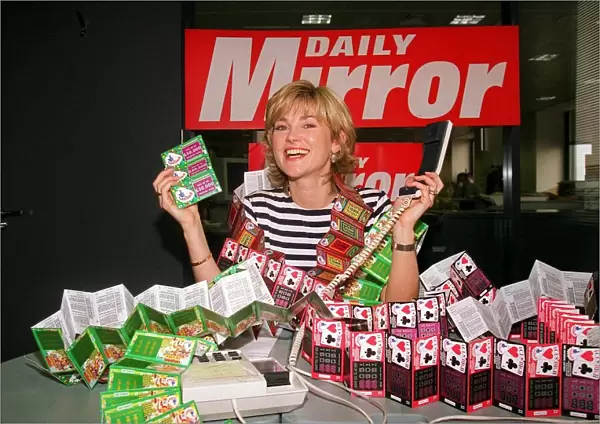 Anthea Turner TV Presenter mans the Daily Mirror National Lottery Scratchcards