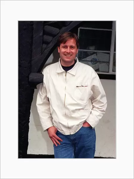 Gary Webster actor standing in archway white jacket denims hand in pocket April 1997