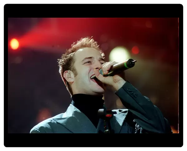 Mikey Graham of pop group Boyzone December 1999 singer singing performing at the SSEC in