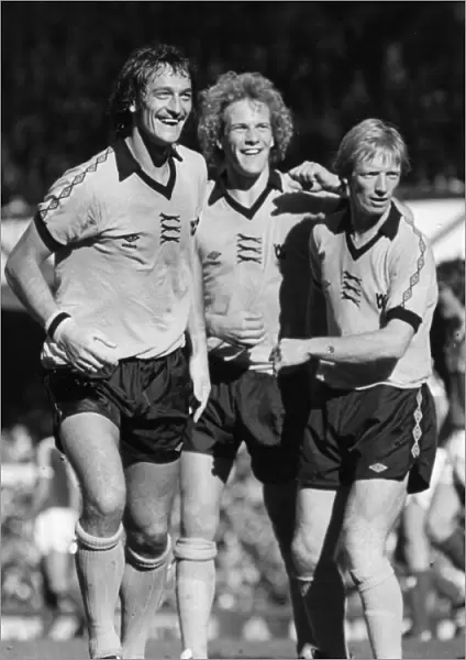 Kenny Hibbitt (left) and Willie Carr (right) congratulate new team mate Andy Gray (centre