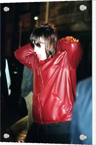 Liam Gallagher of Oasis at the Edinburgh Festival wearing a red leather jacket