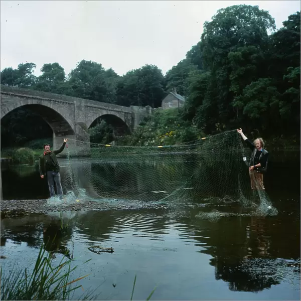 Crime Poaching August 1981 salmon bailiffs on bank of River Tweed holding nets