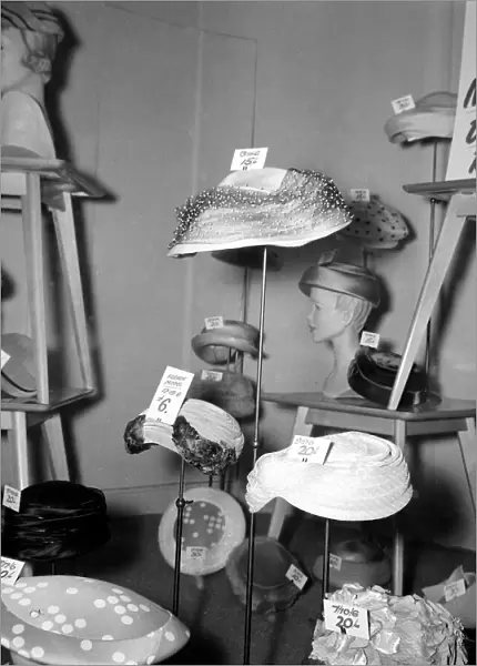 Hats for sale in the window during the January sales in Kensington High Street