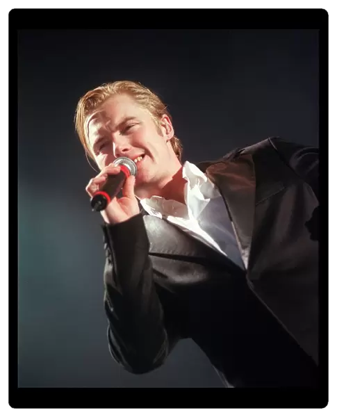 Ronan Keating singing during concert in Glasgow December 1999