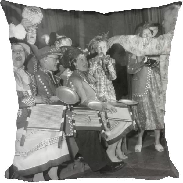 Pearly kings and queens play the washboard and other musical instruments during a concert