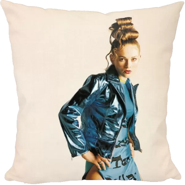 Female model wearing blue jacket and blue dress June 1995
