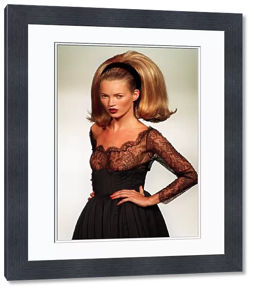 Kate Moss models a Guy Laroche design at the Paris fashion Show Very big hair