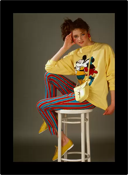 Teenagers dress and fashion, April 1987 Model wearing Mickey Mouse yellow