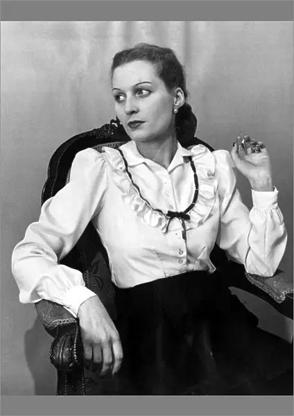 Two-way blouse Fashion clothing shoot January 1948 Woman reclining in chair