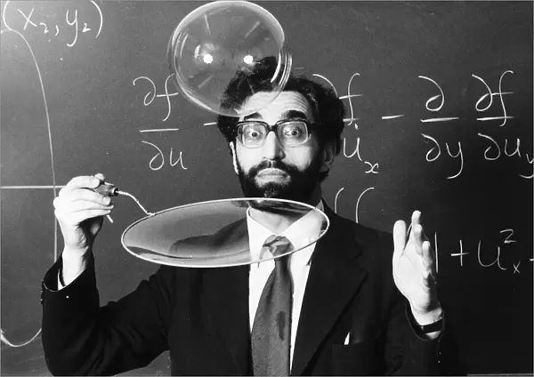 Science lecturer Cyril Isenberg blowing large bubbles March 1980 1980s
