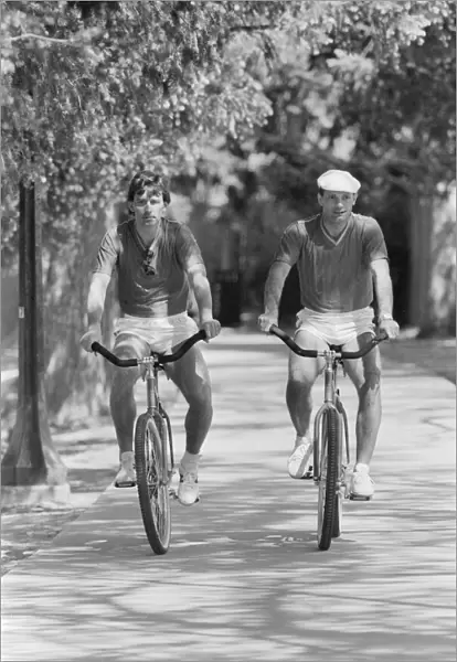England team members Bryan Robson and Ray Wilkins go for a bike ride near their hotel in
