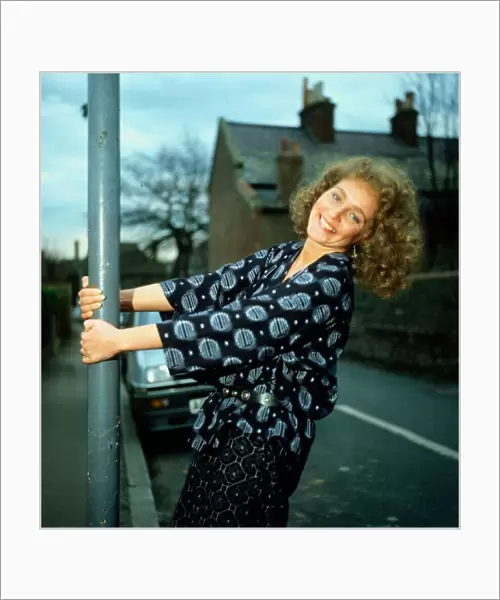 Gail Harrison holding onto lamp-post March 1983