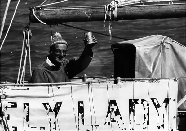 Round the world sailor Alec Rose raises a mug on board his yacht Lively Lady
