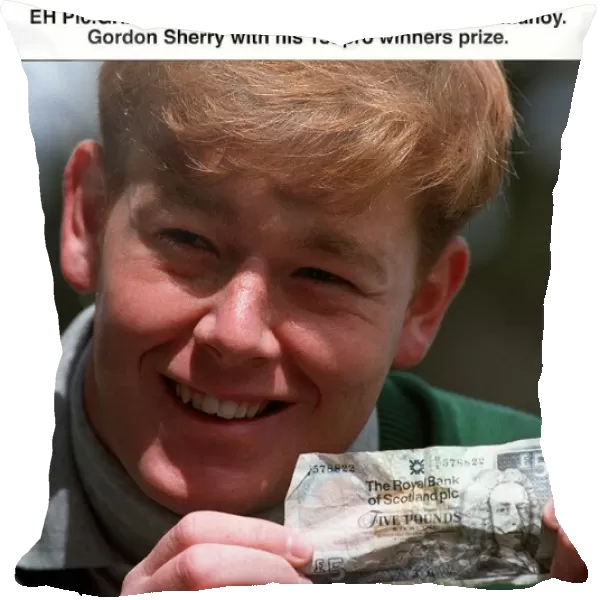 Gordon Sherry golfer holds crumpled five pound note fiver at SPGA ProAm tournament at