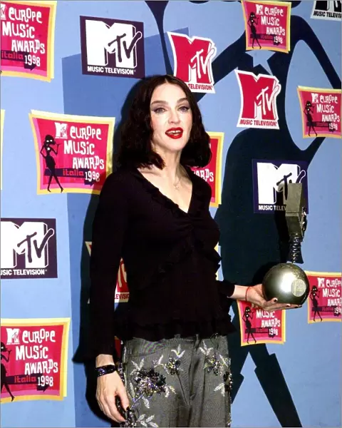 American pop star Madonna holding her award at the MTV Awards Ceremony in Milan