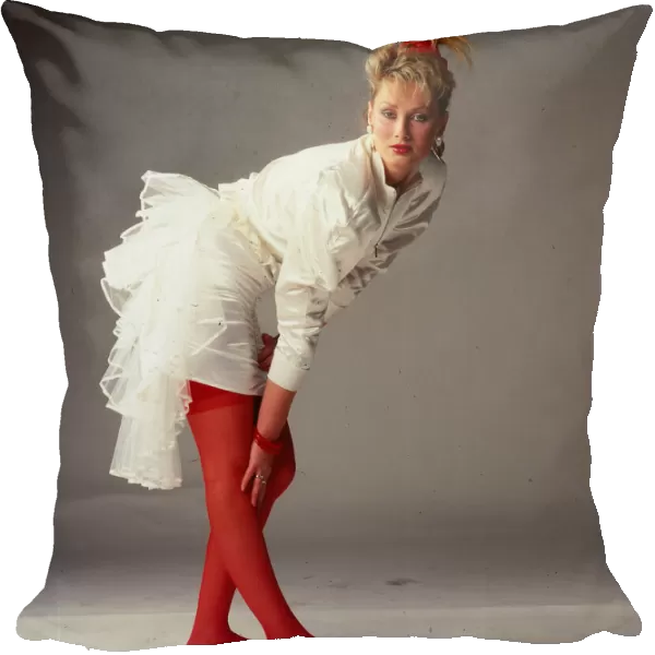 Wedding dress fashion, October 1987 Model wearing white satin dress with mini skirt