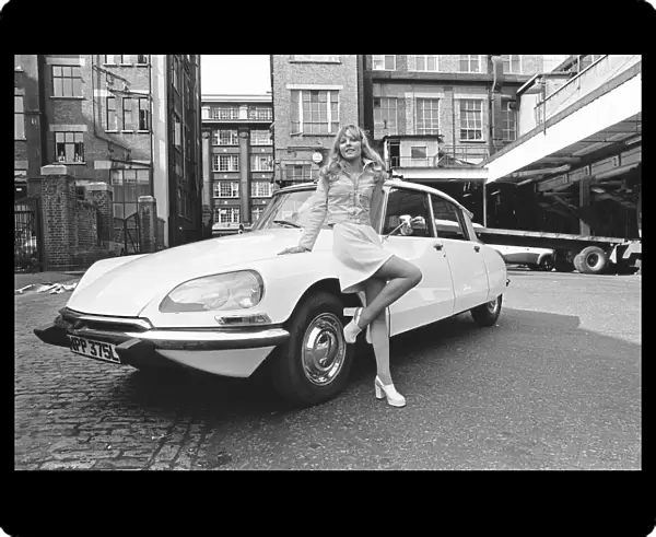 Reveille model seen here posing with a Citroen DS car which is a top prize in
