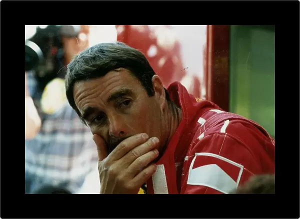 Nigel Mansell Motor Racing Grand Prix Formula One Driver sits with resting his head in
