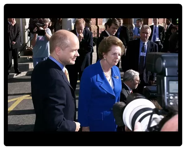 William Hague, Leader of the Conservative party stands alongside Lady Thatcher on her