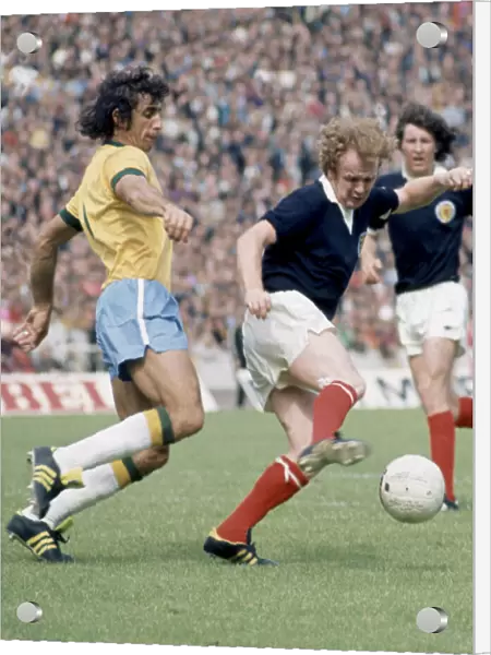 Billy Bremner in action against Wilson Piazza for Scotland in their World Cup match