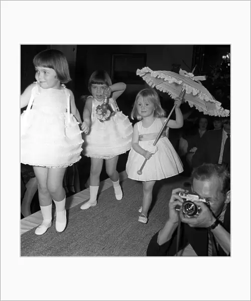 Children modeling their American designer clothes. Model is Cathryn Harrison Grand