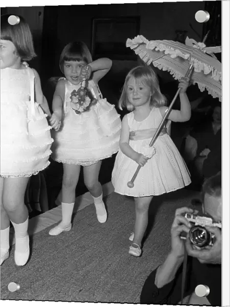 Children modeling their American designer clothes. Model is Cathryn Harrison Grand