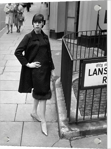 Sixties Fashion by Kiki Byrne Model wearing a black dress with matching coat
