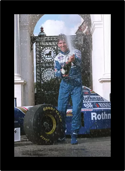 Damon Hill Motor Racing Formula One champion celebrates at Marble Arch with champagne