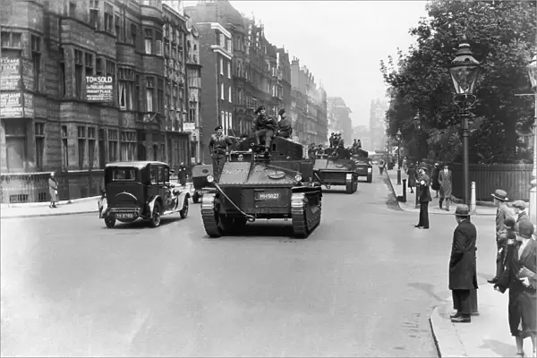 Soldiers seen here patrolling the streets of London in their Vickers Medium tanks