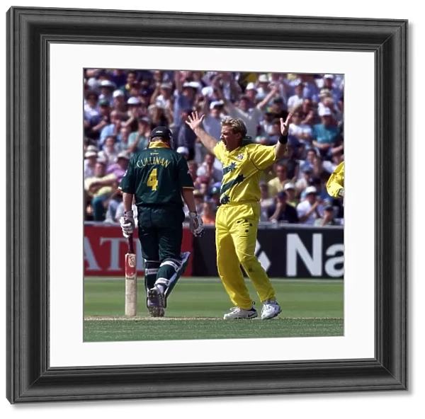 Shane Warne of Australia celebrates after taking the wicket Hansie Cronjie against South