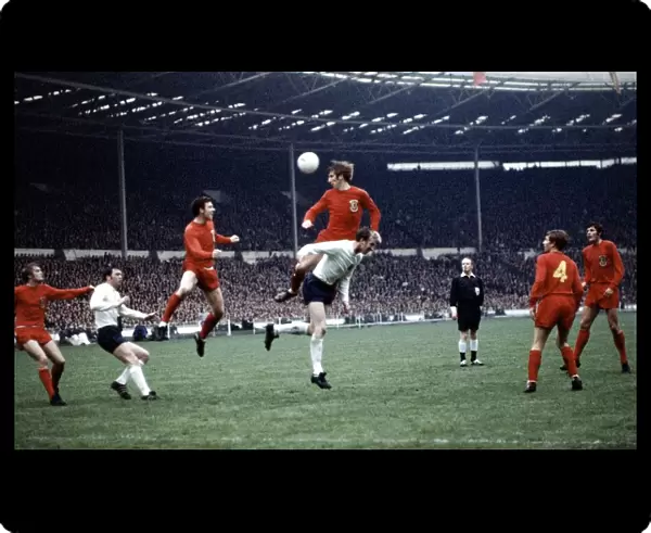 Football England v Wales 1969 Wyn Davies leaps above Jack Charlton May 1969