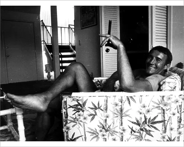 Malcolm Allison football manager 1976 sitting in armchair smoking large cigar